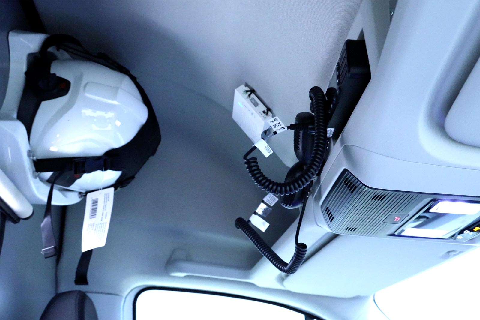 Radio communication system and a white safety helmet secured on the side.
