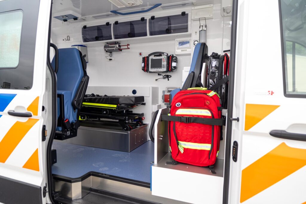 Fully equipped ambulance interior with stretcher, medical monitor and emergency equipment