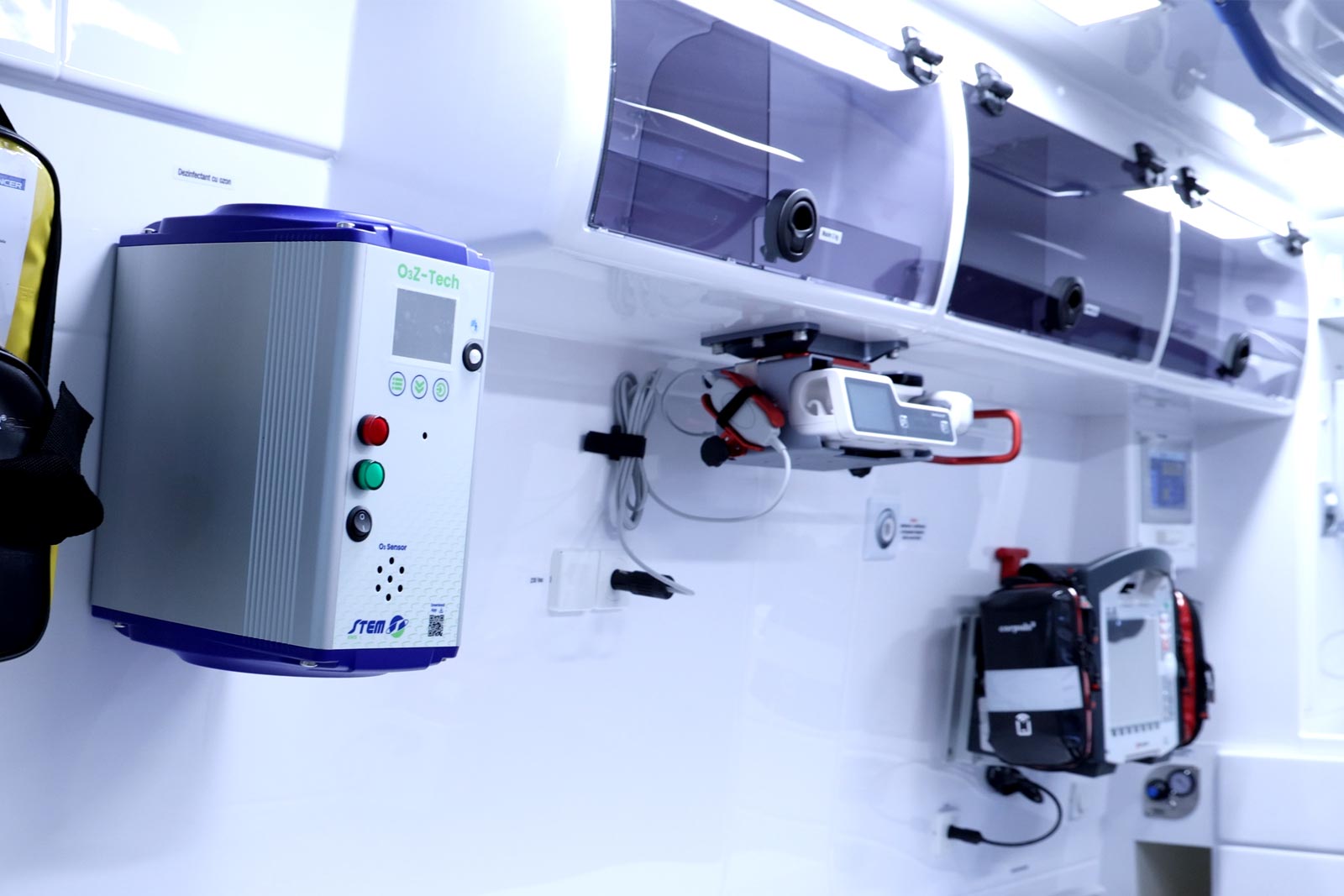 Ozone sanitation device wall-mounted next to storage cabinets