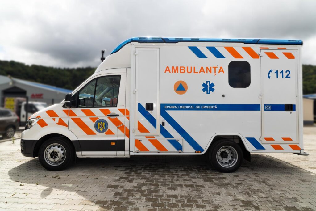 White MAN TGE Type C intensive care ambulance with box body and high-visibility markings